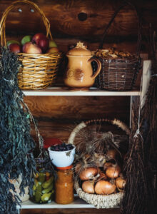Products on the shelves in the pantry. Supplies for the winter. Herbs and conserve